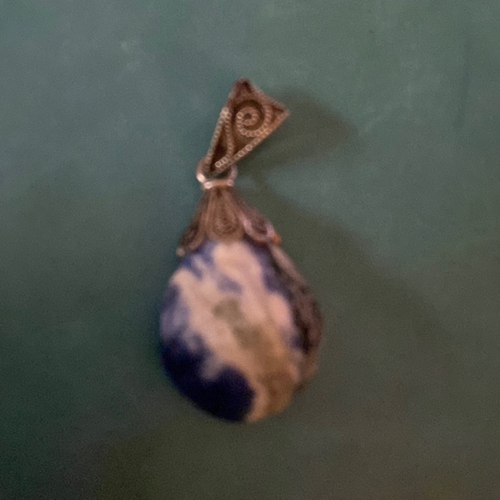 Sodalite gem stone pendant 925  sterling silver markings inside of veil